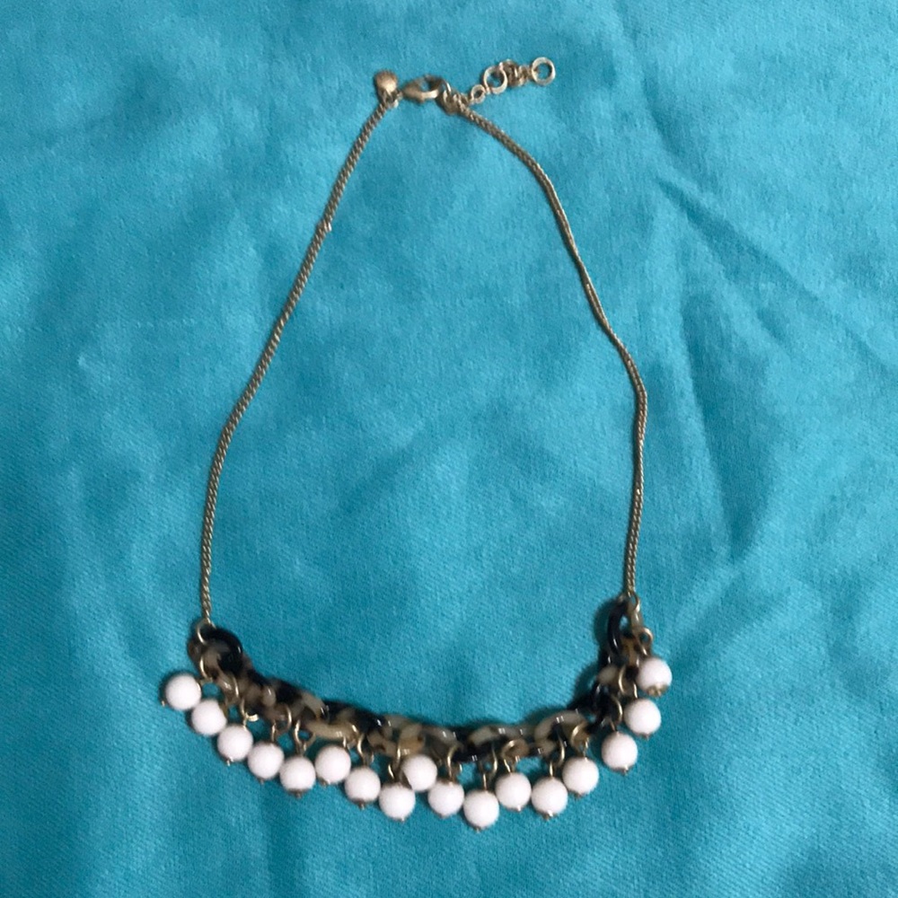 J Crew tortoise shell and white bead necklace with gold tone chain.